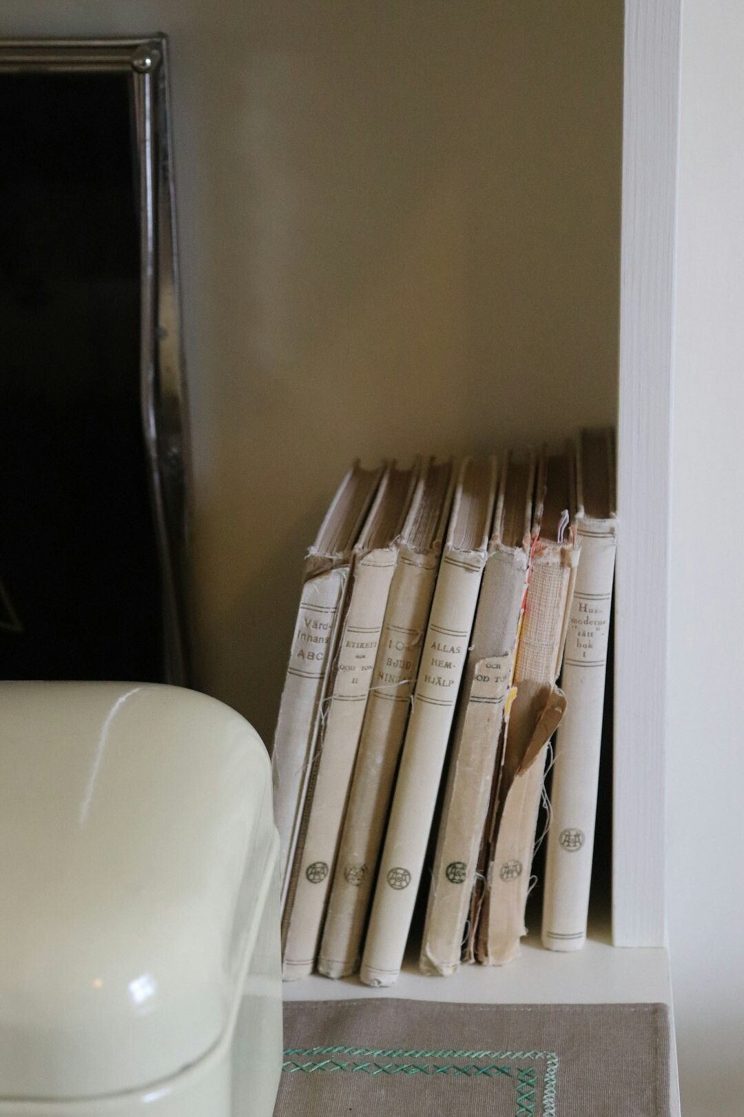 Curated shelf of vintage magazines and archival storage boxes