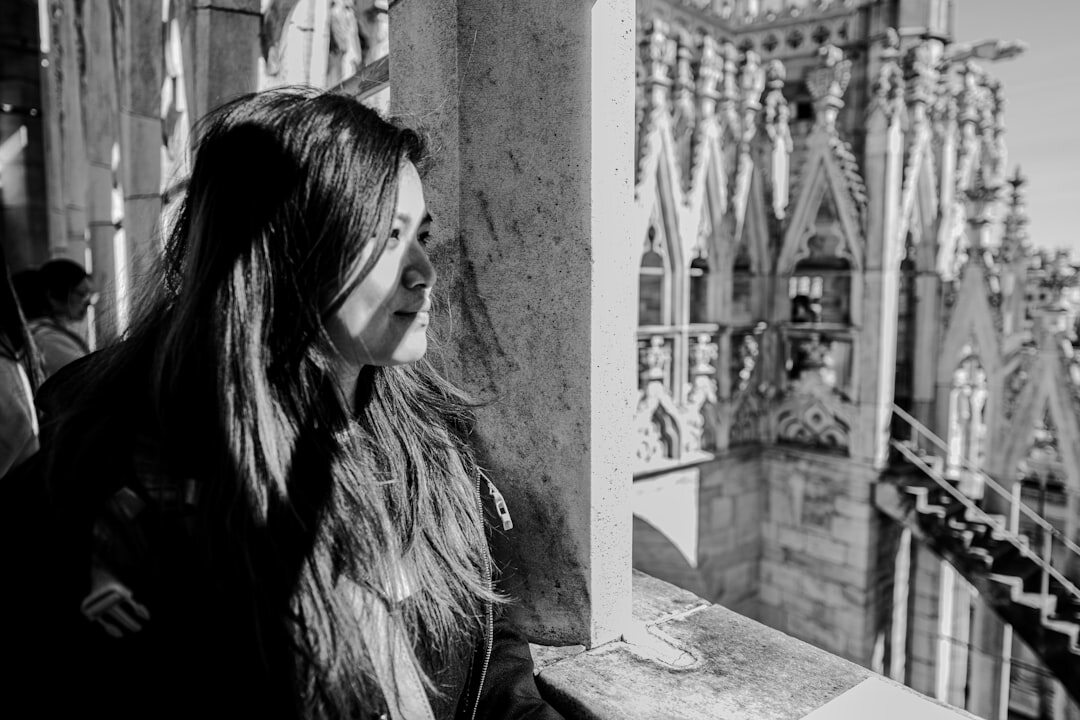 Artistic black and white portrait of a European woman looking away from camera