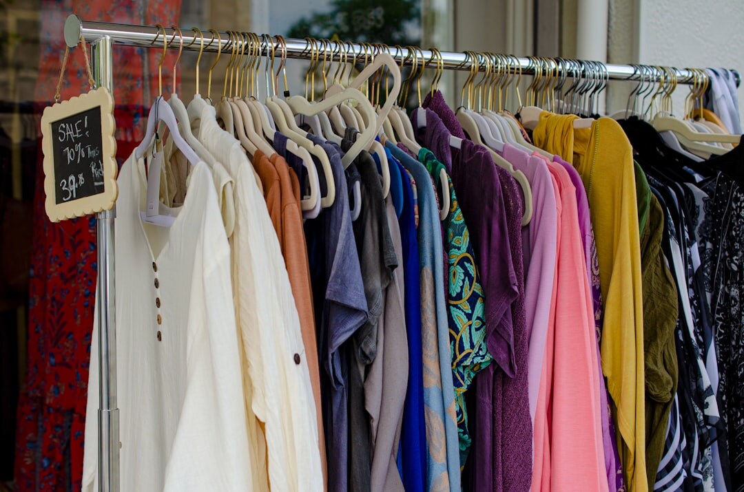 Rack of vintage 1960s couture dresses in an archive room