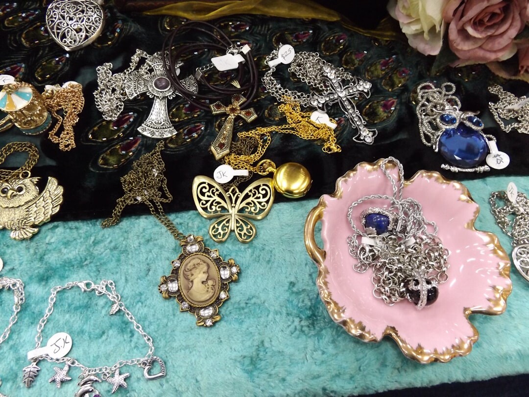 Collection of vintage brooches and jewelry on velvet display