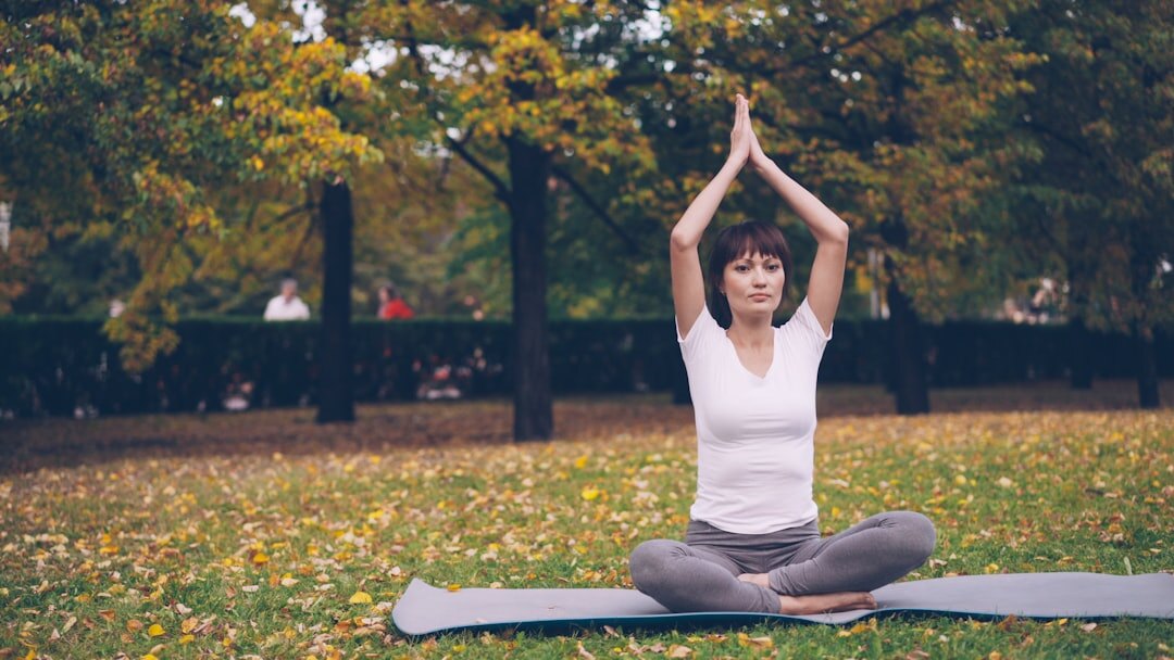 woman doing yoga in park